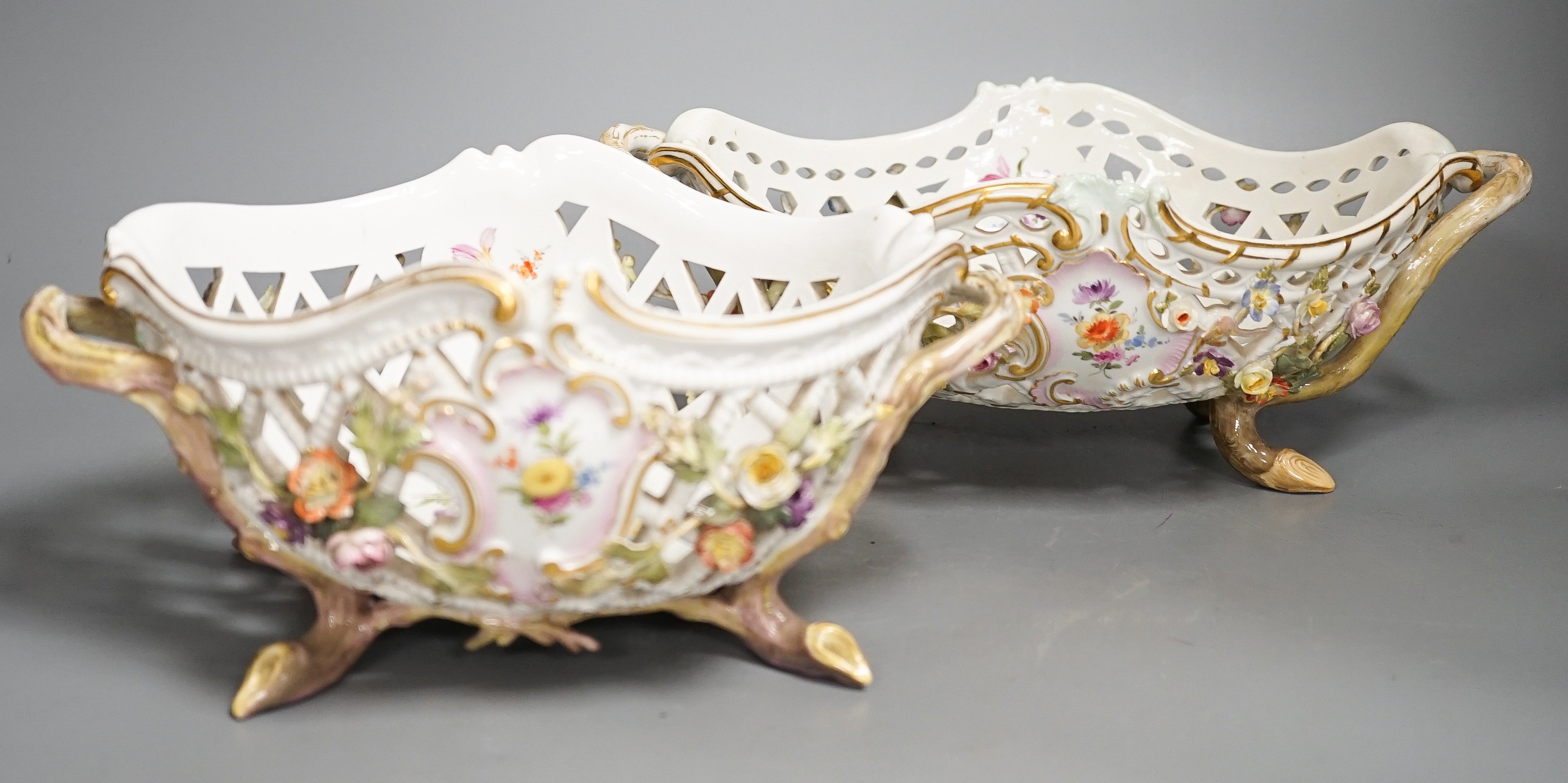 Two similar late 19th century Meissen floral encrusted pierced porcelain bowls 27cm